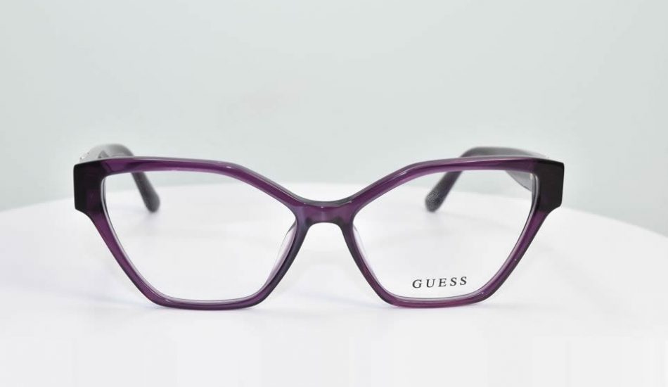 purple framed guess glasses