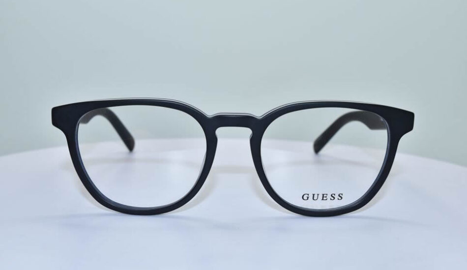 black framed GUESS glasses