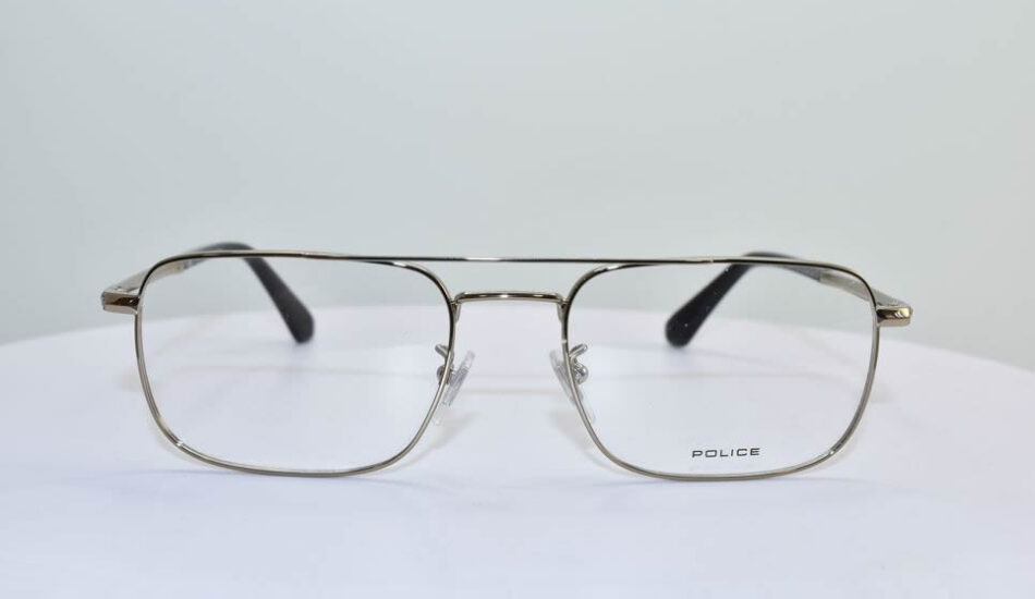 gold framed POLICE glasses