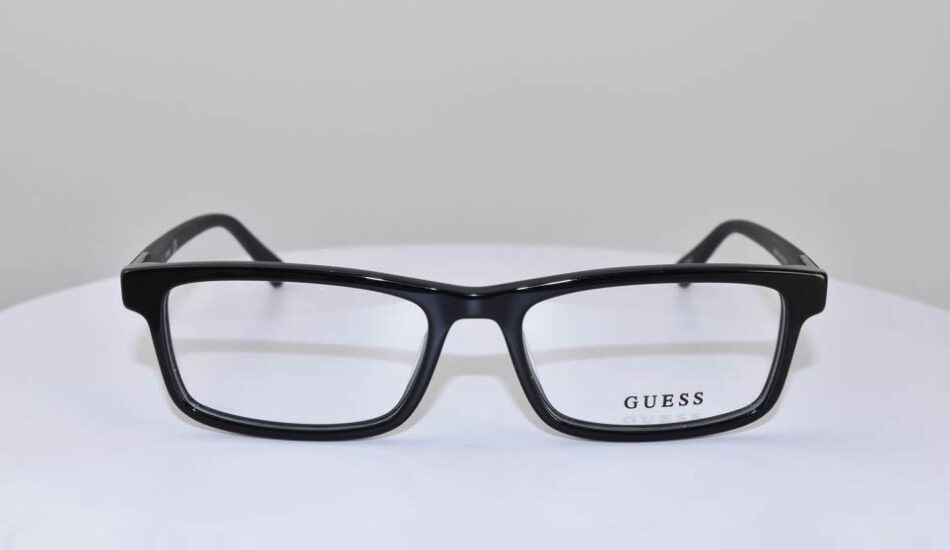 thick black framed guess glasses