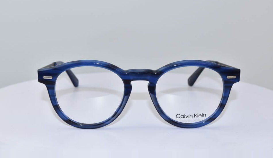 blue and black framed calvin klein glasses