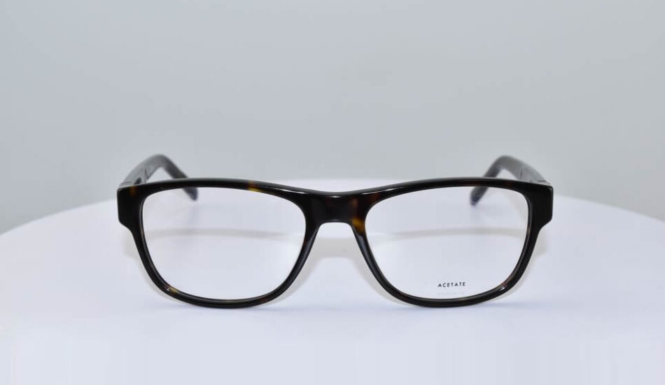 front angle of black and brown ACETATE glasses on white background