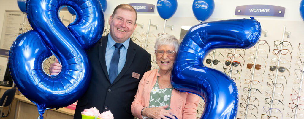Double 85th birthday celebrations for Poulton opticians and loyal customer