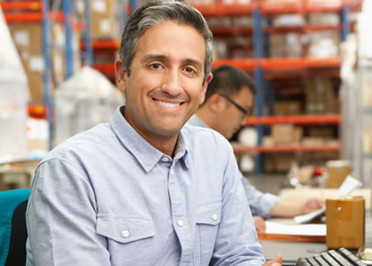 Man in warehouse smiling