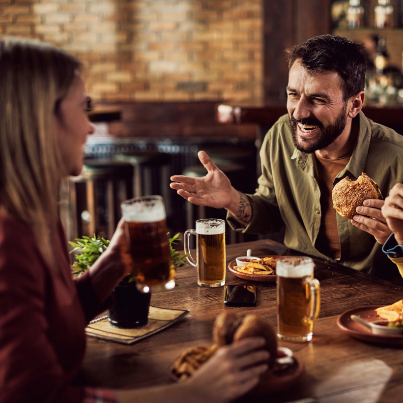 Group of friends having dinner and drinks