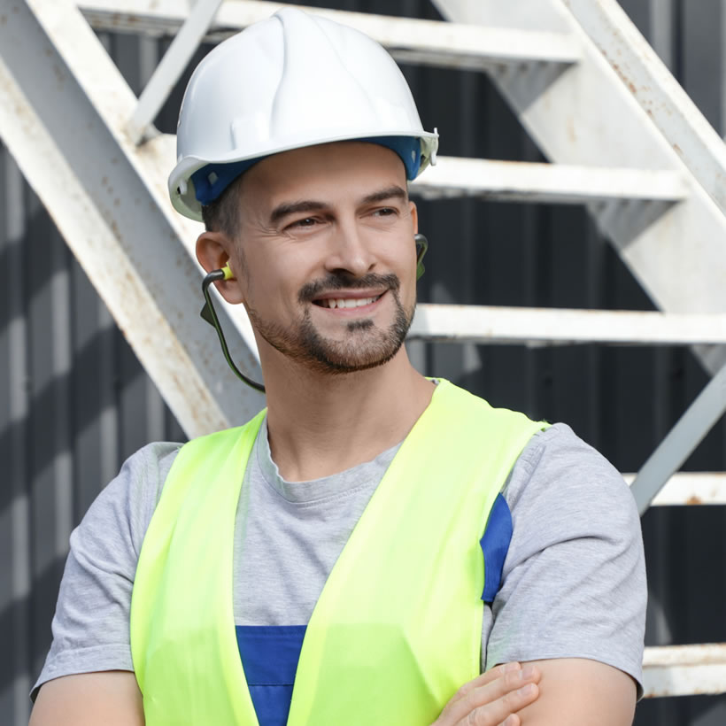 Man in high vis and a hardhat