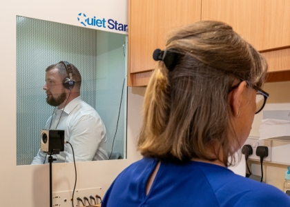Man having hearing test conducted in a Scrivens branch