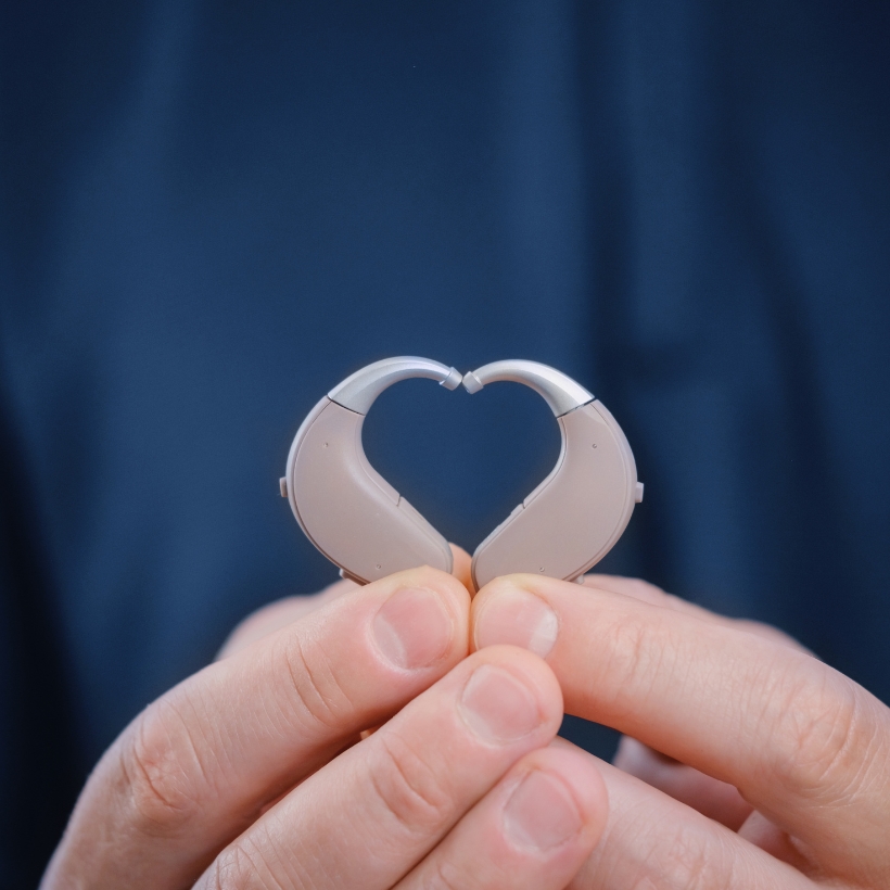 Pair of hearing aids put together in the shape of a heart