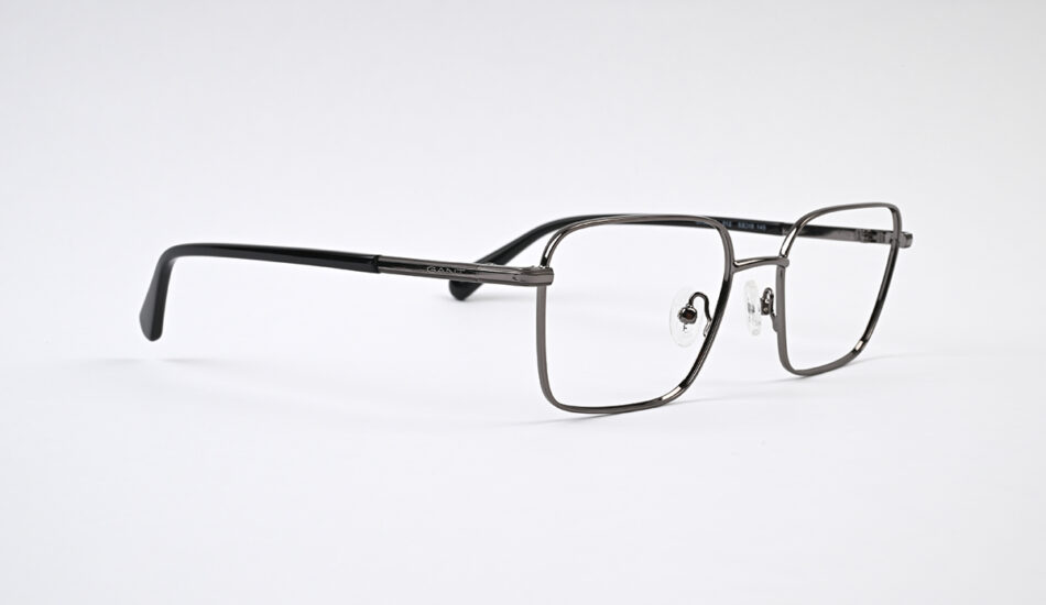 Metal rectangular eyeglasses with nose pads on a white background (studio shot).