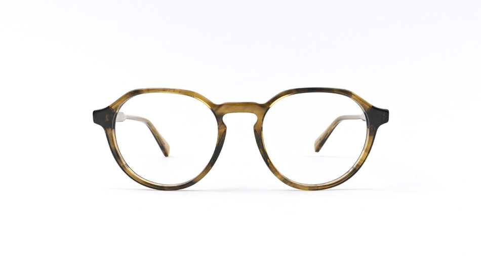 Round tortoiseshell eyeglasses with a keyhole bridge, viewed from the front on a white background.