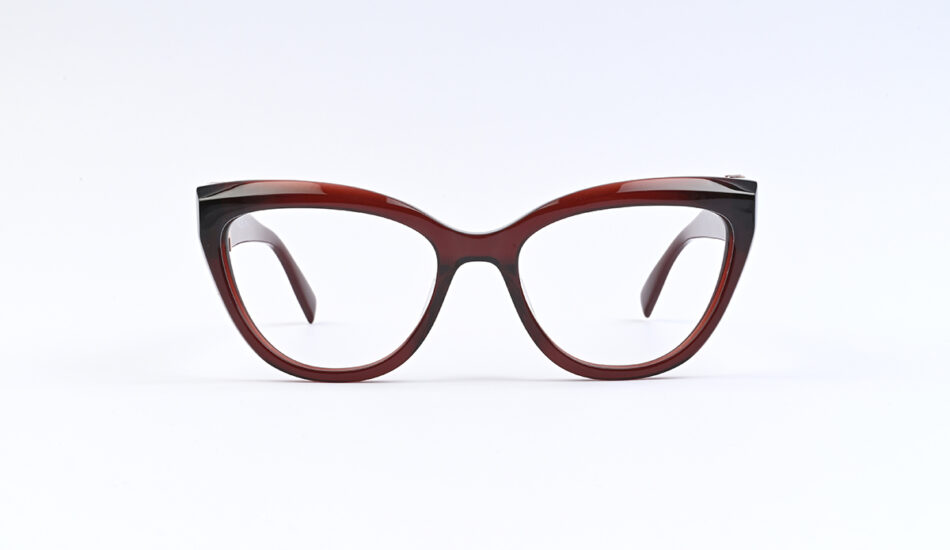 Red tortoiseshell cat-eye eyeglasses on a white background with clear lenses.
