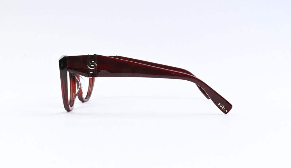 Red burgundy eyeglasses shown in side view, Furla logo on the temple arm