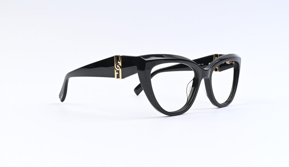 Black chunky-frame eyeglasses with gold hinge accents on the temples.