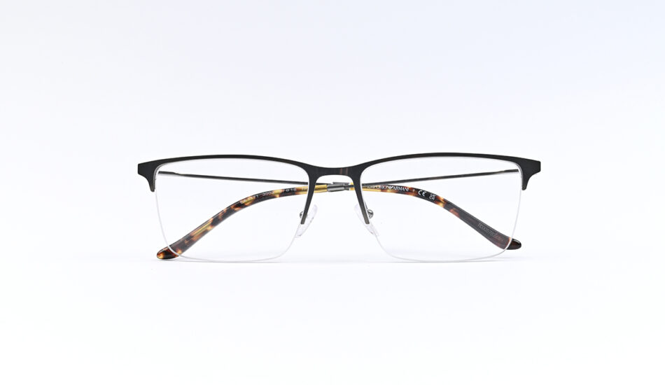 Rectangular eyeglasses with a black upper frame and tortoiseshell temples against a white background