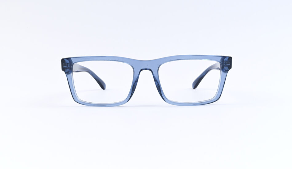 Blue plastic eyeglasses with rectangular lenses on a white surface.