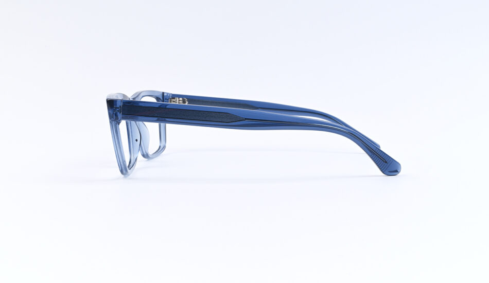 Blue transparent eyeglasses photographed from the side on a white background (lying flat).