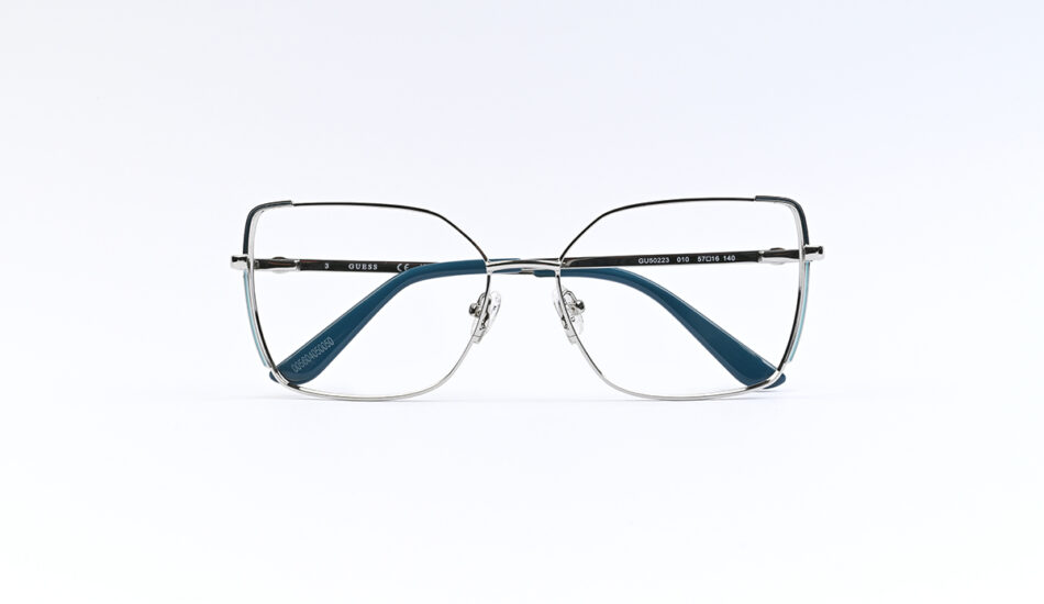Metal rectangular eyeglasses with blue temple tips and Guess branding on the arm, shown from the front on a white background.