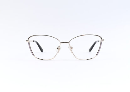 Thin metal-rimmed eyeglasses with adjustable nose pads on a white background, resting on a flat surface, forward-facing